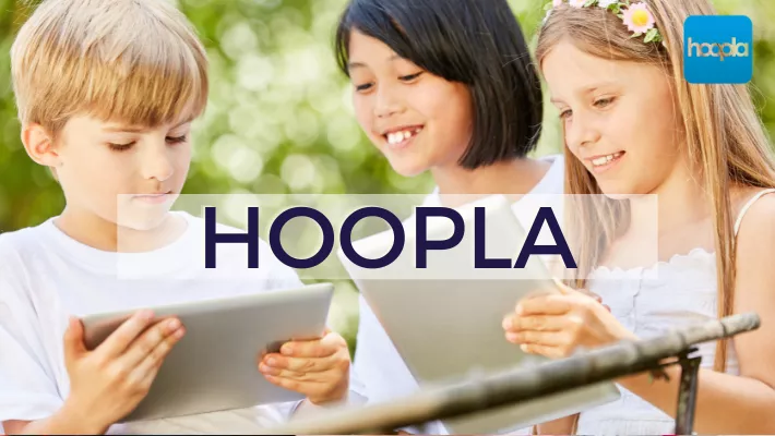 2 girls and 1 boy reading a tablet - hoopla