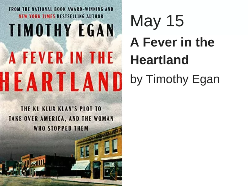 A street with several buildings is at the bottom of the image while the rest of the cover shows a dark cloudy sky. Large red text reads "A fever in the heartland" while smaller black text underneath reads "The Ku Klux Klan's plot to take over America and the woman who stopped them"