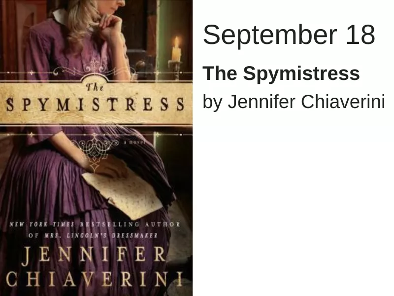 A woman in a purple dress looks down at a piece of paper. The words &quot;The Spymistress&quot; run across the middle